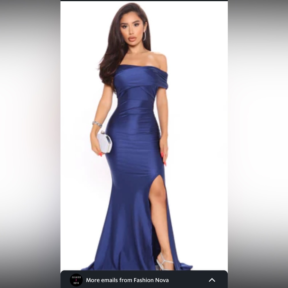Navy blue off shoulders. Bought for a wedding. NEVER WORN